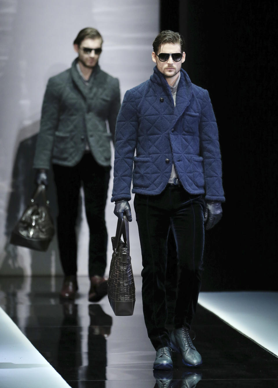 Models wear creations for Giorgio Armani men's Fall-Winter 2013-14 collection, part of the Milan Fashion Week, unveiled in Milan, Italy, Tuesday, Jan. 15, 2013. (AP Photo/Antonio Calanni)