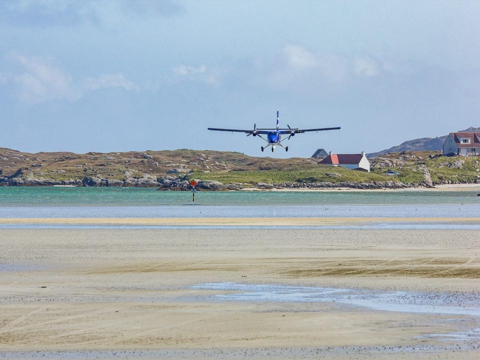 A plane landing on Barra, Scotland