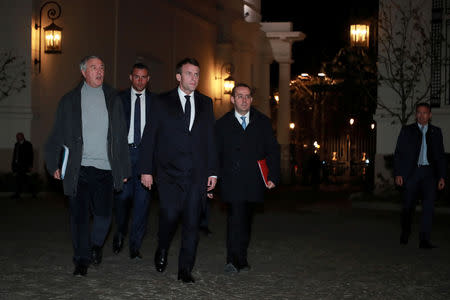 French President Emmanuel Macron (C) arrives for an emergency crisis meeting at the Interior Ministry in Paris, France, late 16 March 2019. Christophe Petit Tesson/Pool via REUTERS