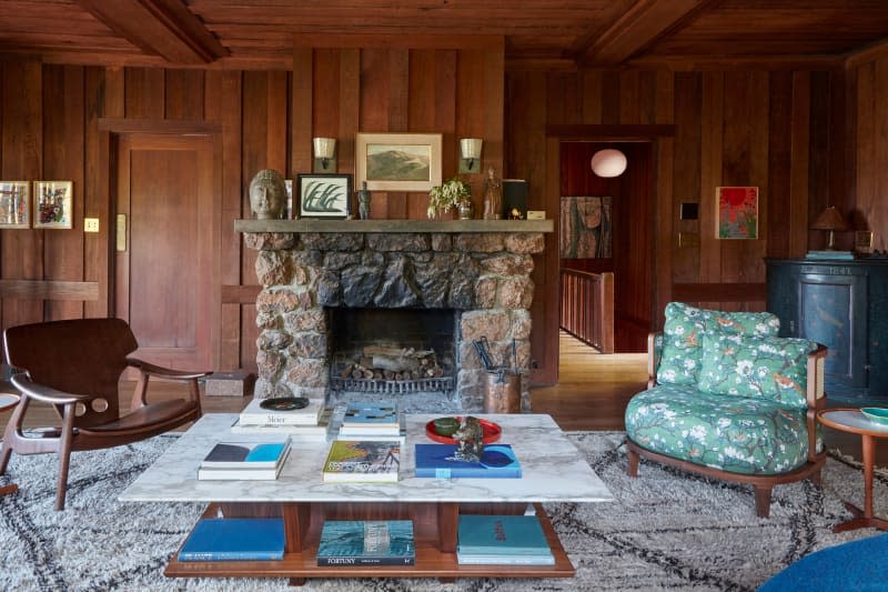 Floral patterned armchair in newly renovated living room.