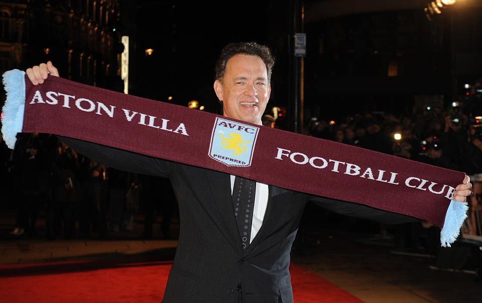 Tom Hanks with an Aston Villa scarf as he arrives for the premiere of Charlie Wilson's War at the Empire cinema in Leicester Square, central London.   (Photo by Joel Ryan - PA Images/PA Images via Getty Images)