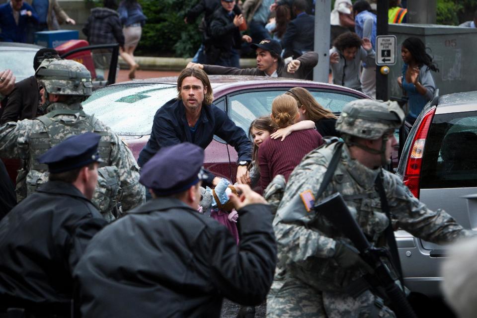 This publicity photo released by Paramount Pictures shows, center, Brad Pitt as Gerald Lane in a scene from the film, "World War Z," from Paramount Pictures and Skydance Productions in association with Hemisphere Media Capital and GK Films. (AP Photo/Paramount Pictures, Jaap Buitendijk)