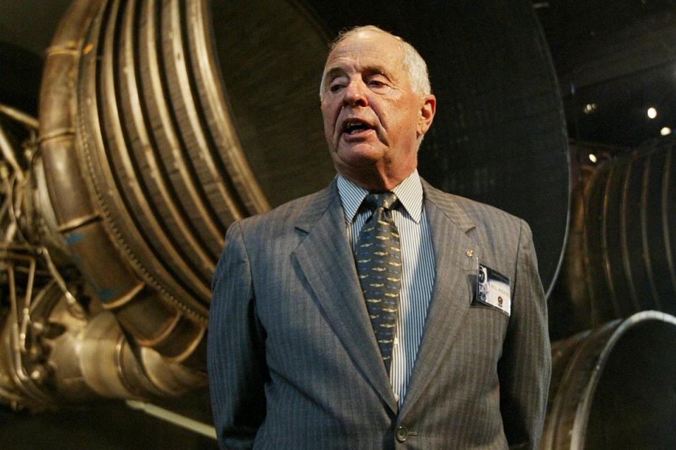 Gen. William Anders, Apollo 8 lunar module pilot, speaks to reporters in front of the tail end of Saturn 5, the F-1 rocket engines of the first stage of the Apollo 11/Saturn 5 launch vehicle, July 20, 2004, in Washington (AP2004)