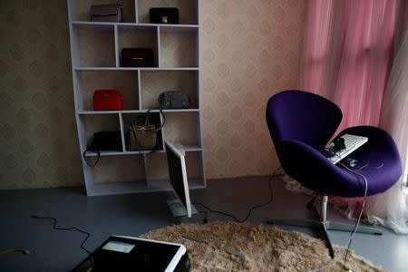 Handbags are seen on a shelf at Three Minute TV, a live streaming talent agency in Beijing, China, February 15, 2017. Picture taken February 15, 2017. REUTERS/Thomas Peter