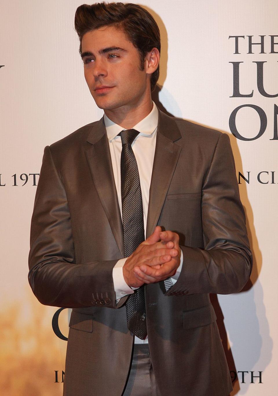 Age has nothing on Zac Efron as he looks breath-taking in this two-piece brown suit