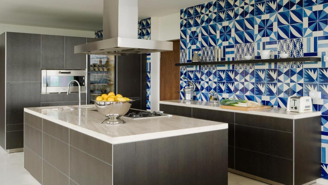 A modem kitchen with blue tiles