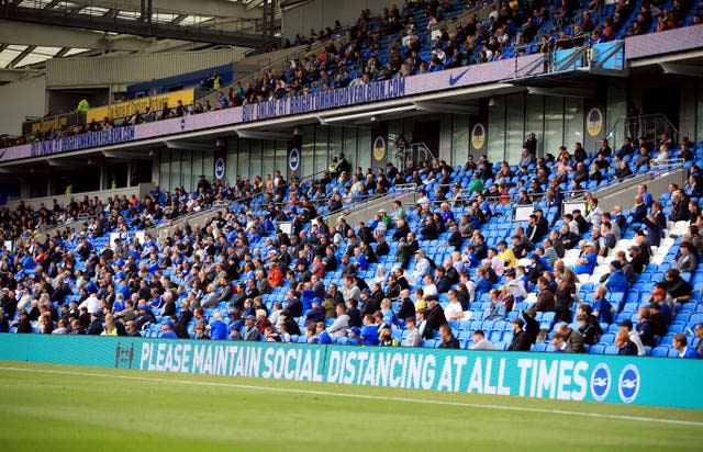 Fans attend a pilot event at Brighton's Amex Stadium