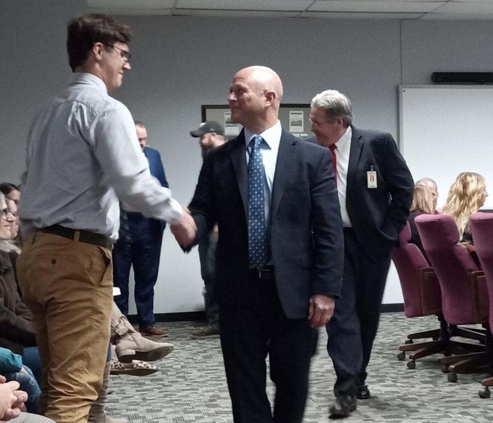 As is customary at the Wayne Highlands school board meetings, the three seniors recognized for outstanding achievements are personally congratulated by the board directors and superintendent. At the Dec. 5, 2023, meeting, seniors Calgon Downey, Nicholas Eisele and Avery Ohliger were honored. Ohliger is shown being congratulated by Superintendent Gregory Frigoletto. Behind Frigoletto is board member George Korb.