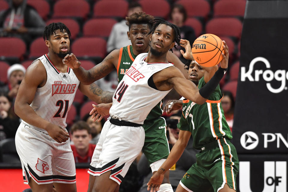 Louisville forward Jae'Lyn Withers (24) tracks down a loose ball during the first half of an NCAA college basketball game against Florida A&M in Louisville, Ky., Saturday, Dec. 17, 2022. (AP Photo/Timothy D. Easley)