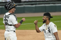 Chicago White Sox's Jose Abreu, right, celebrates with catcher James McCann after the White Sox defeated the Chicago Cubs 9-5 in a baseball game in Chicago, Saturday, Sept. 26, 2020. (AP Photo/Nam Y. Huh)