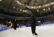 Evgeny Plyushchenko celebrates with Russia's figure skating team after the flower ceremony at the Sochi 2014 Winter Olympics, February 9, 2014. REUTERS/Alexander Demianchuk