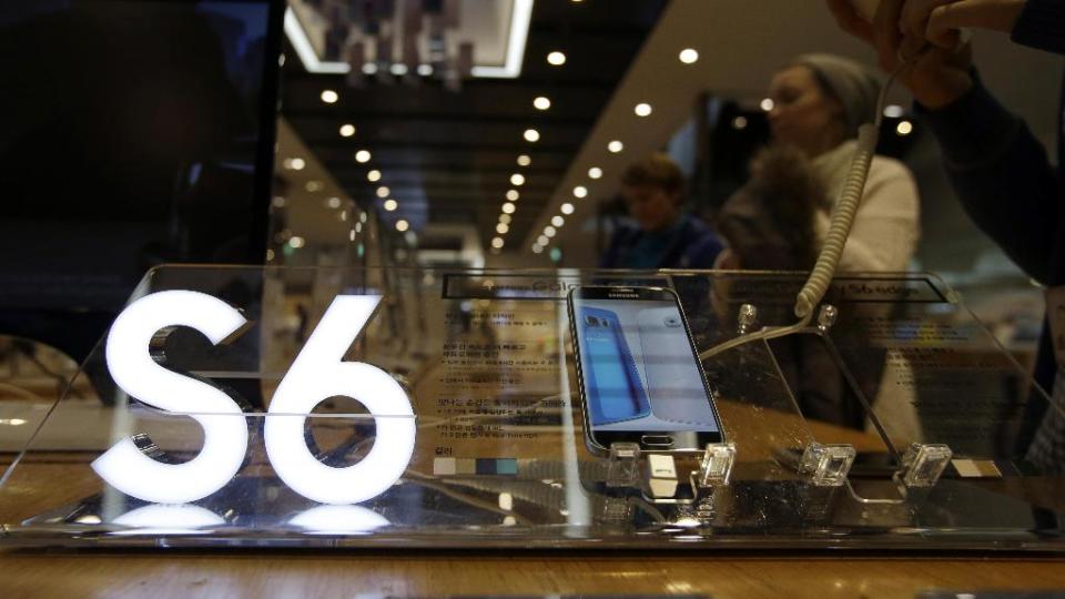 Visitors look at Samsung's new smartphone the Galaxy S6 