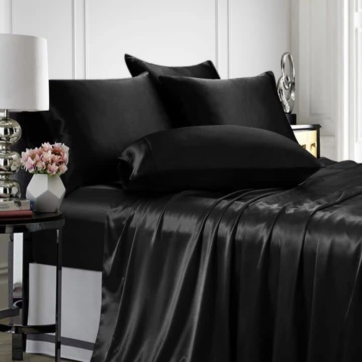 black satin sheets on the bed