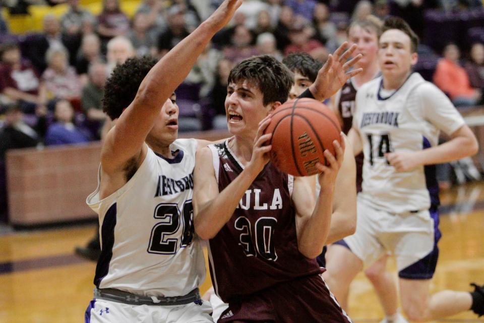 Eula's Clayton Gray drives against Westbrook's Jimmy Roberts in a bi-district playoff game on Monday.