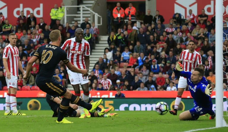 Tottenham's Harry Kane (2L) scores his team's fourth goal during their Premier League match against Stoke