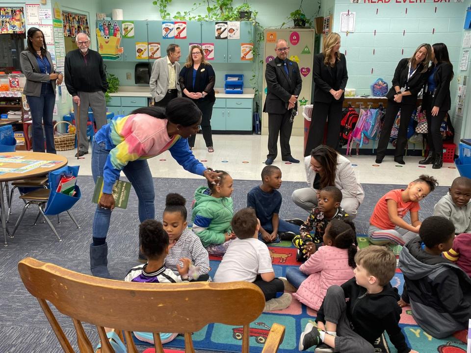 Local entrepreneur and philanthropist L. Gale Lemerand (second from back right) visits a classroom at Palm Terrace Elementary in November, when he donated $100,000 to the Daytona Beach school.