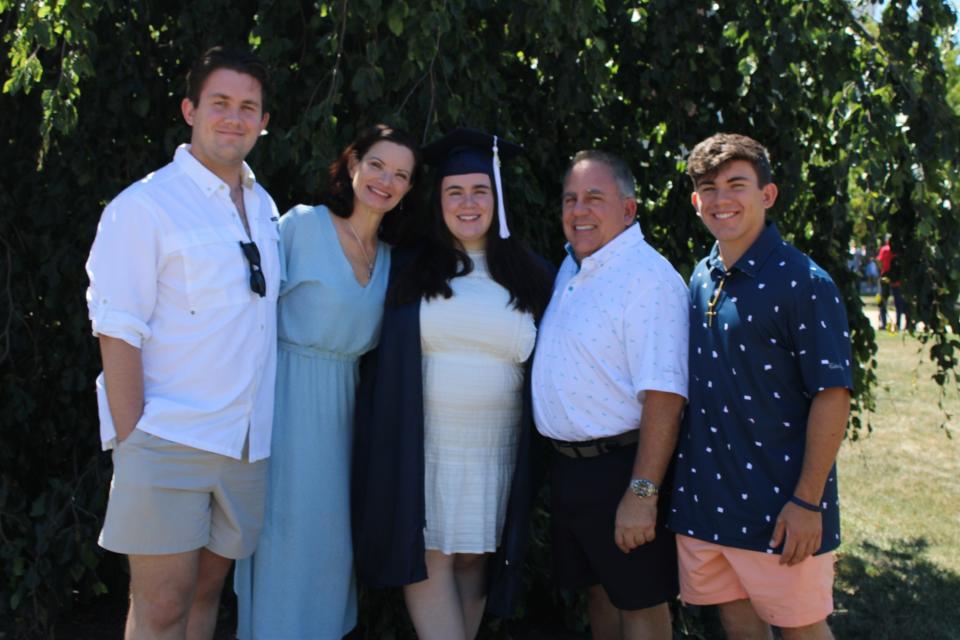 Christine Pelillo poses with her family in celebration of her daughter's graduation.