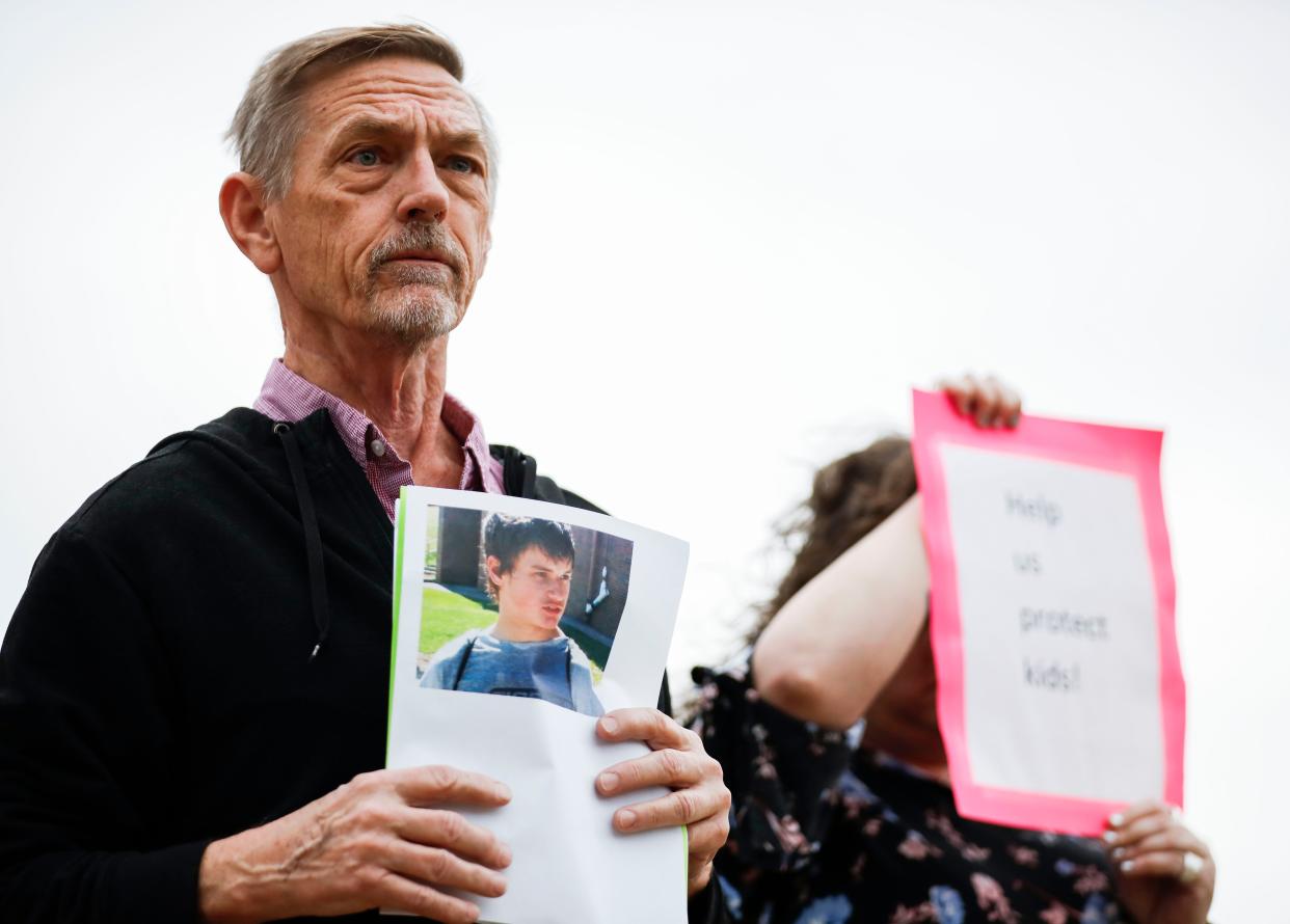 David Clohessy, the former national director of SNAP (Survivors Network of those Abused by Priests), holds a photo of the late Jason Britt outside the U.S. federal courthouse in Springfield on Tuesday, Oct. 24, 2023. Britt died last year of multiple organ failure at age 29, more than a decade after attending Agape Boarding School.