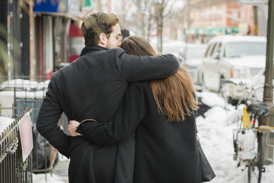 man and woman embracing