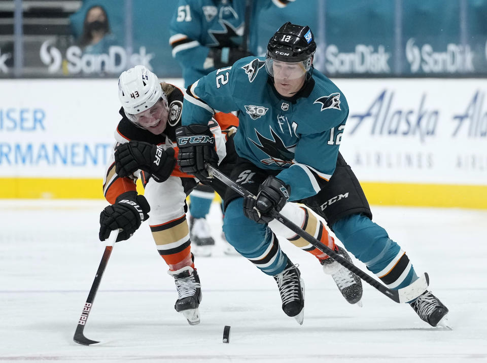 San Jose Sharks center Patrick Marleau (12) skates up the ice past Anaheim Ducks center Danton Heinen (43) during the third period of an NHL hockey game Wednesday, April 14, 2021, in San Jose, Calif. (AP Photo/Tony Avelar)