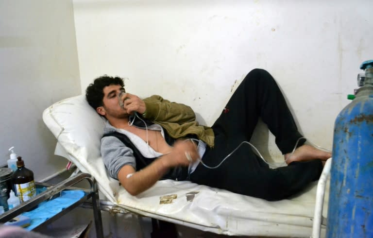 A young man, pictured in March 2015, breathes with an oxygen mask at a clinic in a Syrian village following reports of suffocation cases related to an alleged regime gas attack in the area