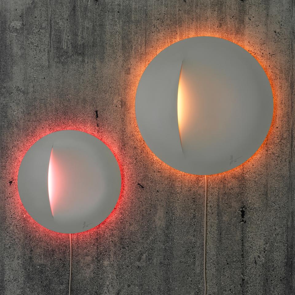 Sabine Marcelis’s wall lamps ($40-$60), which come in two different sizes and can change to five different colors, explore the wonderful effects created by a dynamic light emanating from a single, solid surface.