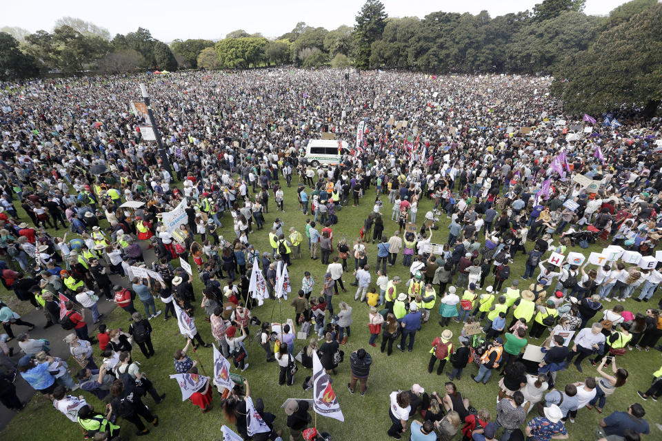 Thousands of protestors, many of them school students, gather in Sydney, Friday, Sept. 20, 2019, calling for action to guard against climate change. Australia's acting Prime Minister Michael McCormack has described ongoing climate rallies as "just a disruption" that should have been held on a weekend to avoid inconveniencing communities. (AP Photo/Tiger Balsmeyer)