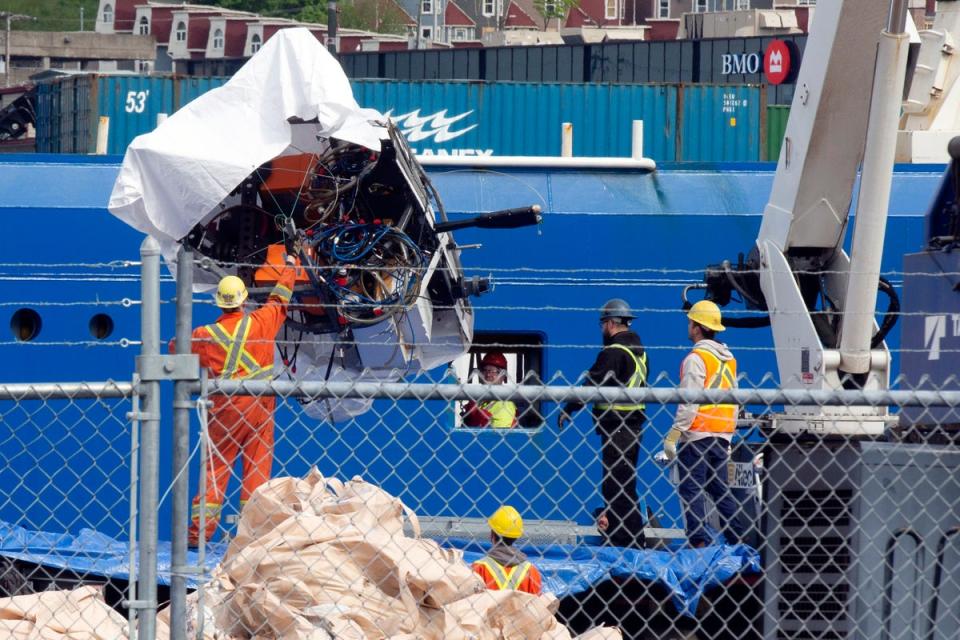 Debris from the Titan submersible, recovered from the ocean floor near the wreck of the Titanic, is unloaded from the ship Horizon Arctic at the Canadian Coast Guard pier in St. John's, Newfoundland, Wednesday, June 28, 2023 (AP)