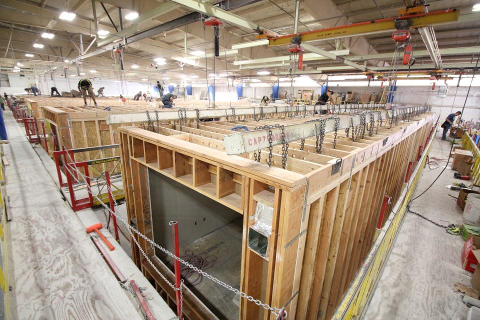 Built section-by-section in a factory, hotel units are shipped to a site and stacked, sometimes practically overnight. Photo credit: Guerdon Modular Buildings.