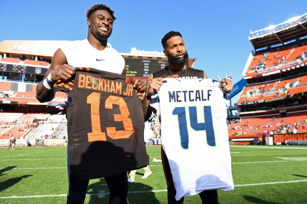 Odell Beckham Jr of the LSU Tigers poses with a jersey after he