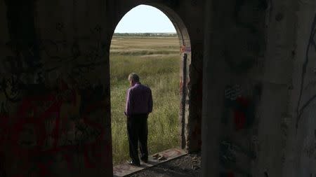 Jay Reinke is shown in this film production still photo framed by the doorway of an abandoned church, in the film "The Overnighters" in this undated handout photo in Williston, North Dakota, provided by Drafthouse Films October 7, 2014. REUTERS/Drafthouse Films