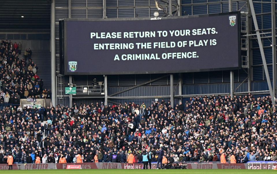 West Brom v Wolves crowd trouble: police use batons as players are called off the pitch