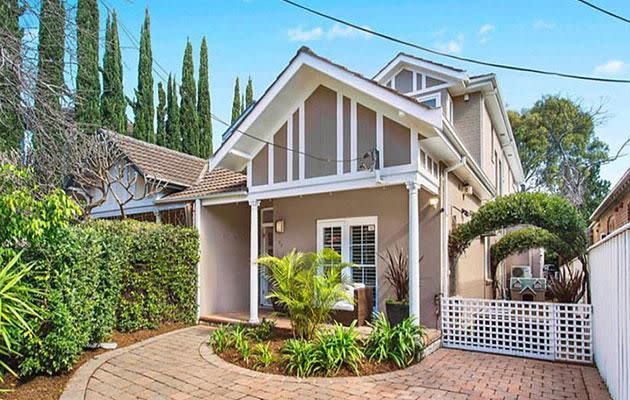 The home used to be beige but has now been painted charcoal. Photo: Ray White