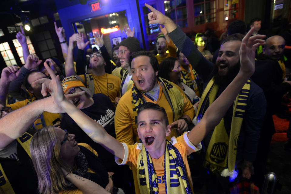 FILE - In this Nov. 19, 2019, file photo, Nashville SC fans cheer after the player selections were finished by the team's management in the Major League Soccer expansion draft Tuesday, in Nashville, Tenn. Nashville SC opens their inaugural MLS season on Saturday. (AP Photo/Mark Zaleski, File)