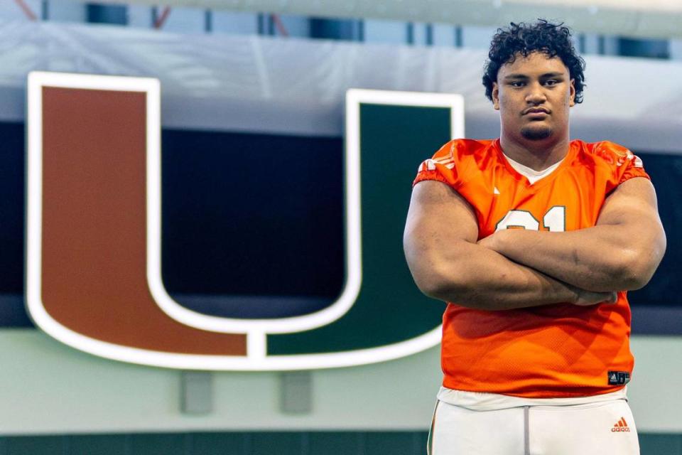 University of Miami offensive lineman Francis Mauigoa (61) strikes a pose during media availability at UM’s Carol Soffer Indoor Practice Facility in Coral Gables, Florida, on Tuesday, August 22, 2023.