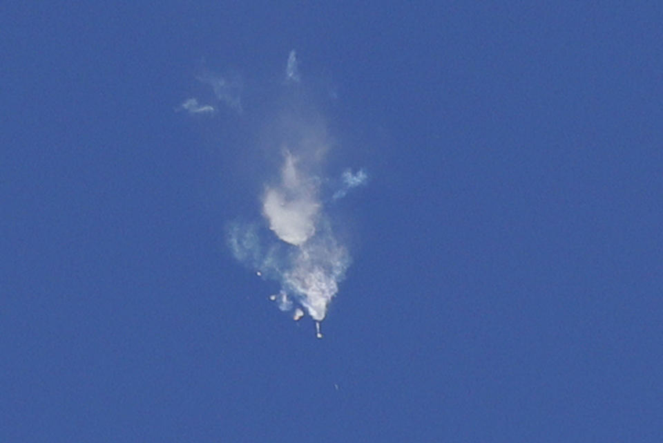 Smoke rise as the boosters of first stage of the Soyuz-FG rocket with Soyuz MS-10 space ship carrying a new crew to the International Space Station, ISS, separate after the launch at the Russian leased Baikonur cosmodrome, Kazakhstan, Thursday, Oct. 11, 2018. The Russian rocket carries U.S. astronaut Nick Hague and Russian cosmonaut Alexey Ovchinin. The two astronauts are making an emergency landing after a Russian booster rocket carrying them into orbit to the International Space Station has failed after launch. (AP Photo/Dmitri Lovetsky)