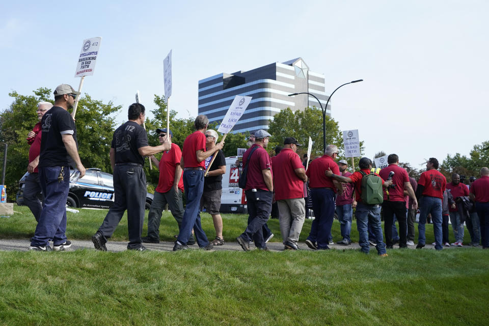 United Auto Workers march outside the Stellantis North American Headquarters, Wednesday, Sept. 20, 2023, in Auburn Hills, Mich. (AP Photo/Carlos Osorio)