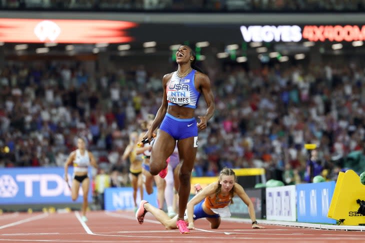 <span class="article__caption">BUDAPEST, HUNGARY – AUGUST 19: Alexis Holmes of Team United States crosses the finish line to win the 4x400m Mixed Relay Final as Femke Bol of Team Netherlands falls during day one of the World Athletics Championships Budapest 2023 at National Athletics Centre on August 19, 2023 in Budapest, Hungary. (Photo by Shaun Botterill/Getty Images)</span>