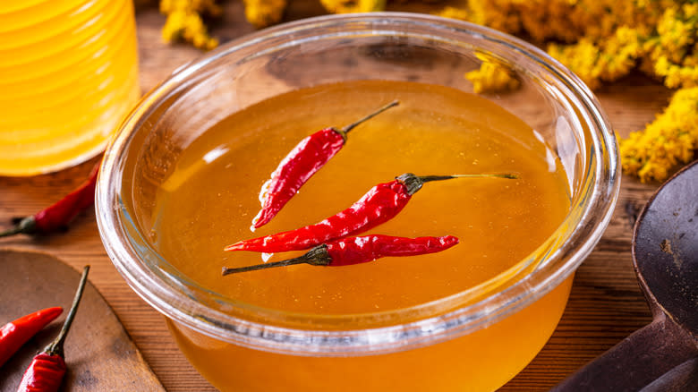 bowl of hot honey with chilis
