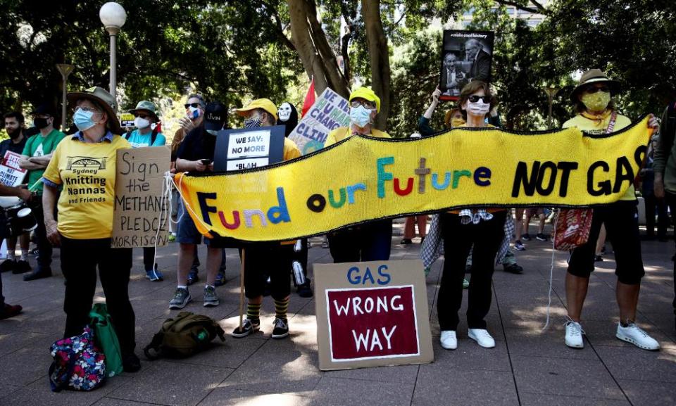 Climate activists are seen during a Cop26 protest march in Hyde Park on 6 November  in Sydney