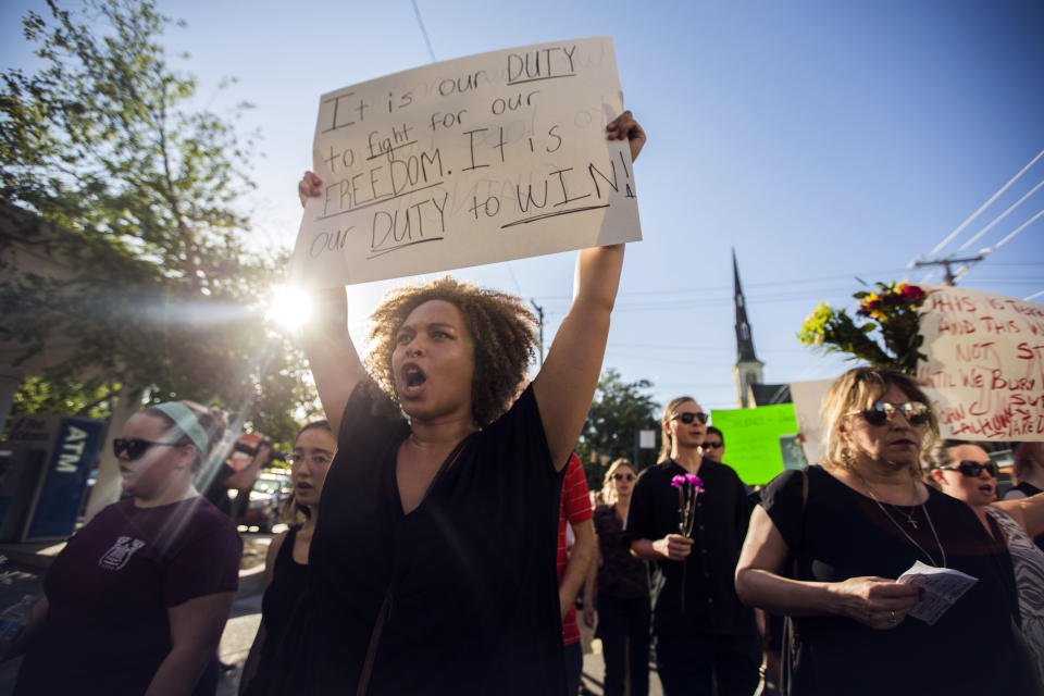 Adriana Boyd shouts slogans during a remembrance march in memory of the Emanuel AME Church shooting victims Saturday, June 20, 2015, in Charleston, S.C. (AP Photo/Stephen B. Morton)