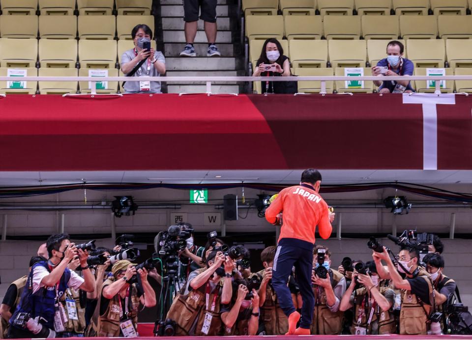 Naohisa Takato wins gold medal in the Men's Judo 60g tournament.