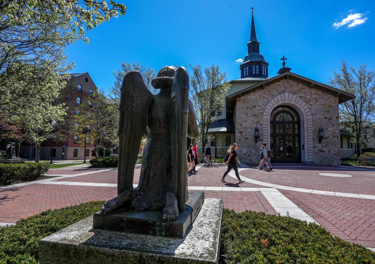 An angel statue in front of St. Dominic Chapel on the Providence College campus.