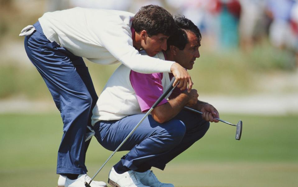 Jose-Maria Olazabal of Spain uses the shoulders of Seve Ballesteros - Getty Images