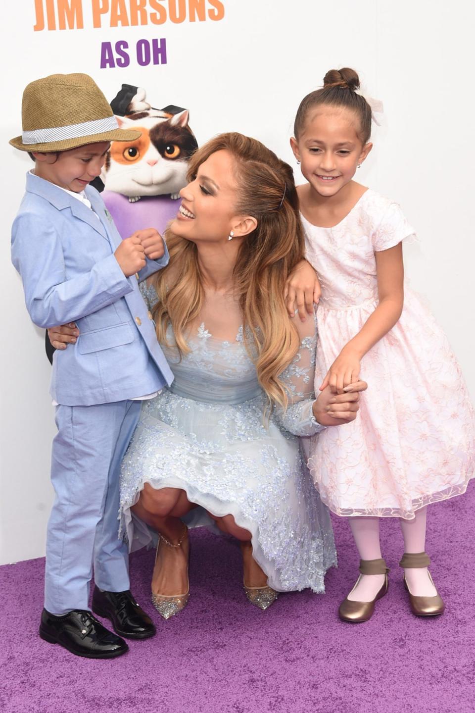 Afflex said Lopez’s 14-year-old-children, daughter Emme (R) and son Max pictured when they were younger, were a ‘blessing and a gift’ (Getty)