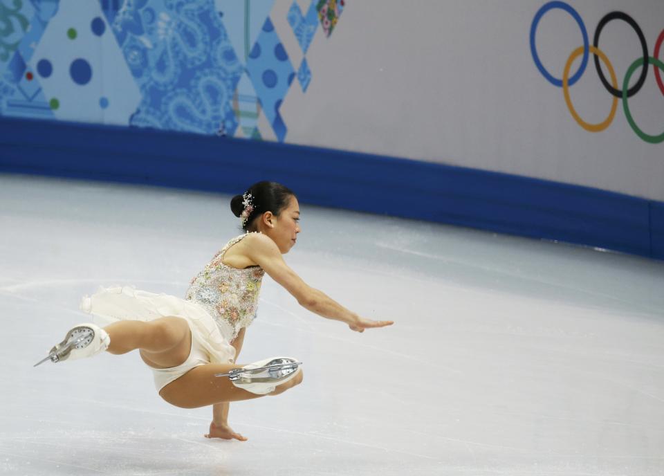 Japan's Akiko Suzuki falls as she competes during the Figure Skating Women's free skating Program at the Sochi 2014 Winter Olympics, February 20, 2014. REUTERS/Issei Kato (RUSSIA - Tags: OLYMPICS SPORT FIGURE SKATING)