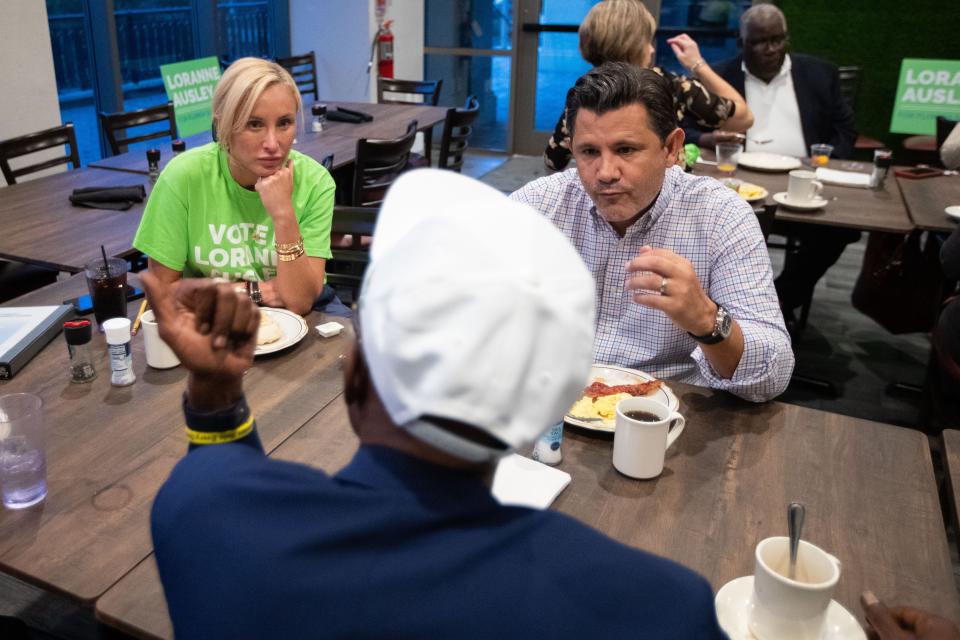 Senators Lauren Book, left, and Jason Pizzo speak with local Tallahasseean Stanley Sims during a campaign breakfast for Loranne Ausley on Wednesday, Oct. 26, 2022.