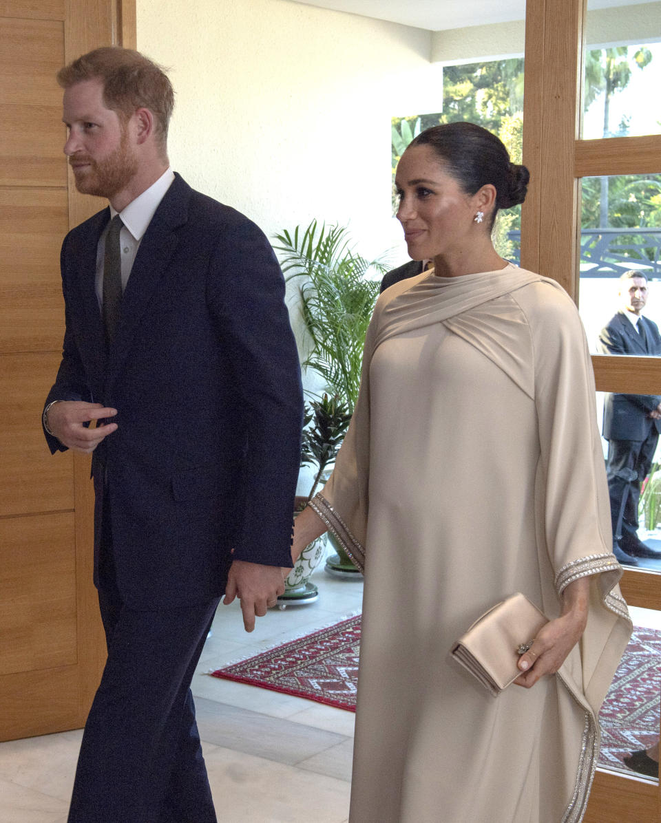 Harry, 34, wore a navy suit and dark green tie as he and his wife met with military representatives and a group of young female entrepreneurs. Photo: Getty