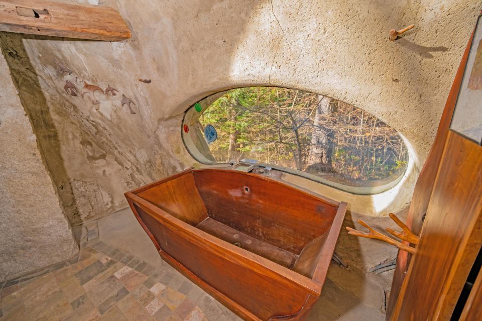 The cherry wood bath is a stunning feature. (SWNS)