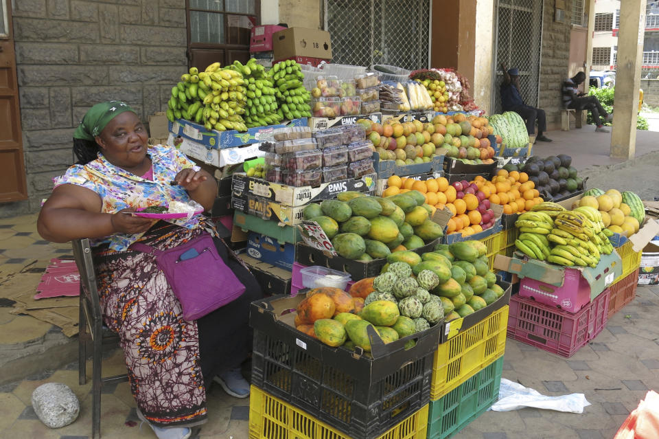 FILE - A vendor sells groceries on the roadside, during the International Women's Day on the outskirts of Nairobi, Kenya, on March 8, 2024. (AP Photo/Sayyid Azim, File)